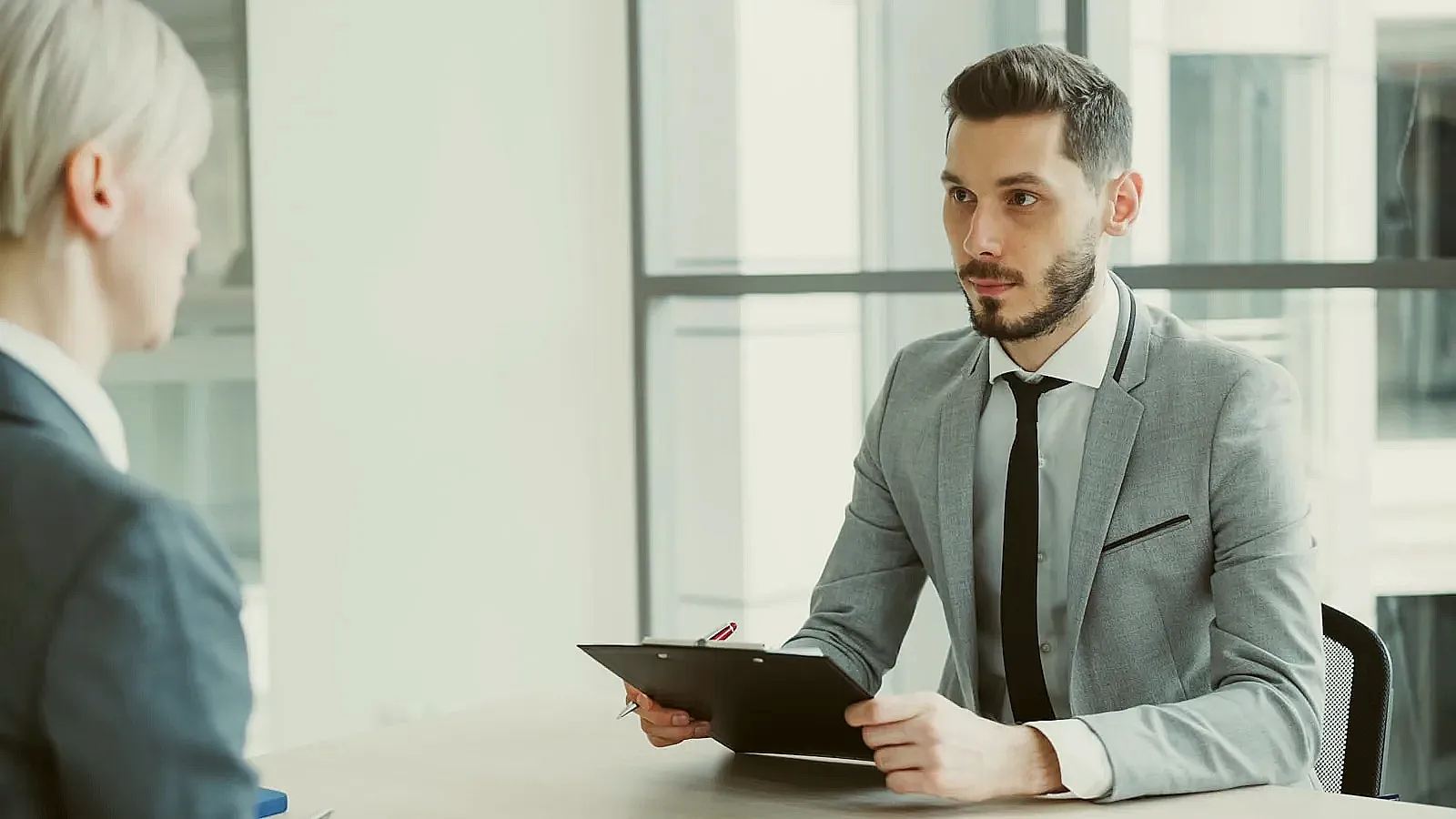 A candidate confidently explaining their career path during an interview.