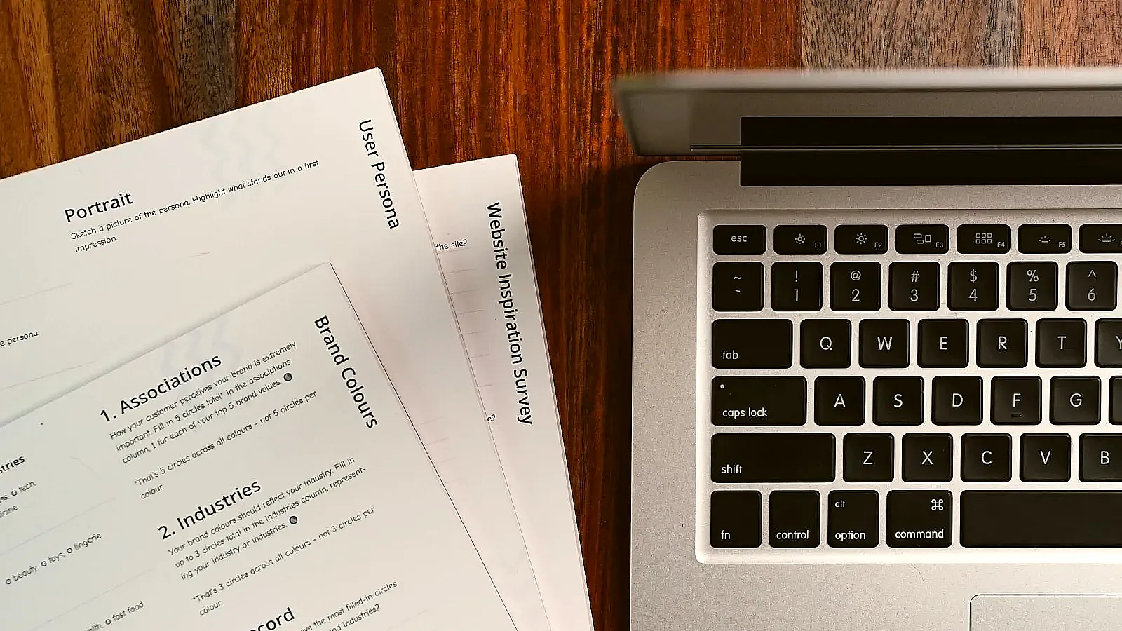 A recruiter quickly scanning a stack of printed resumes.