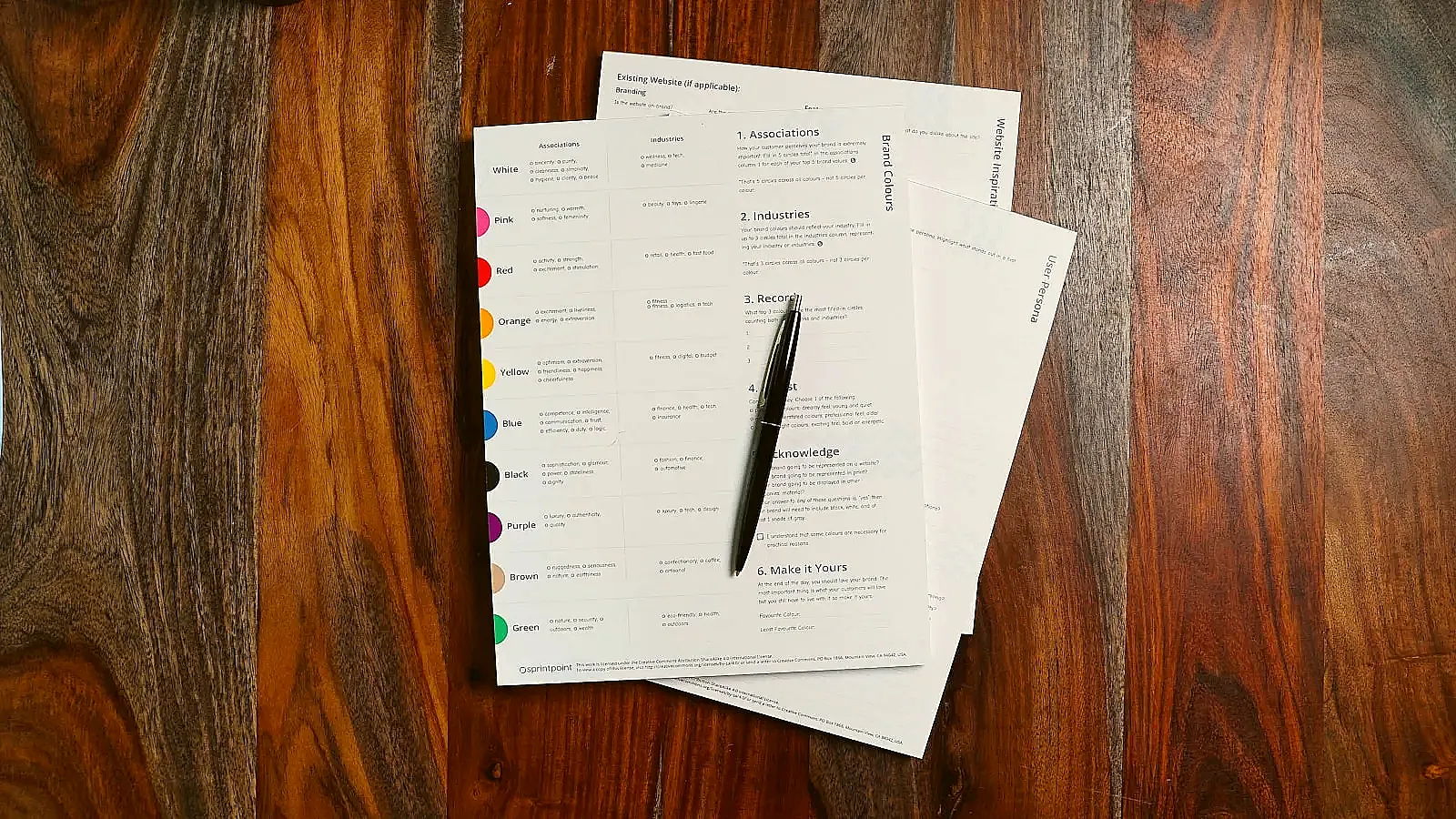 A resume and cover letter being reviewed together on a desk during a job application.